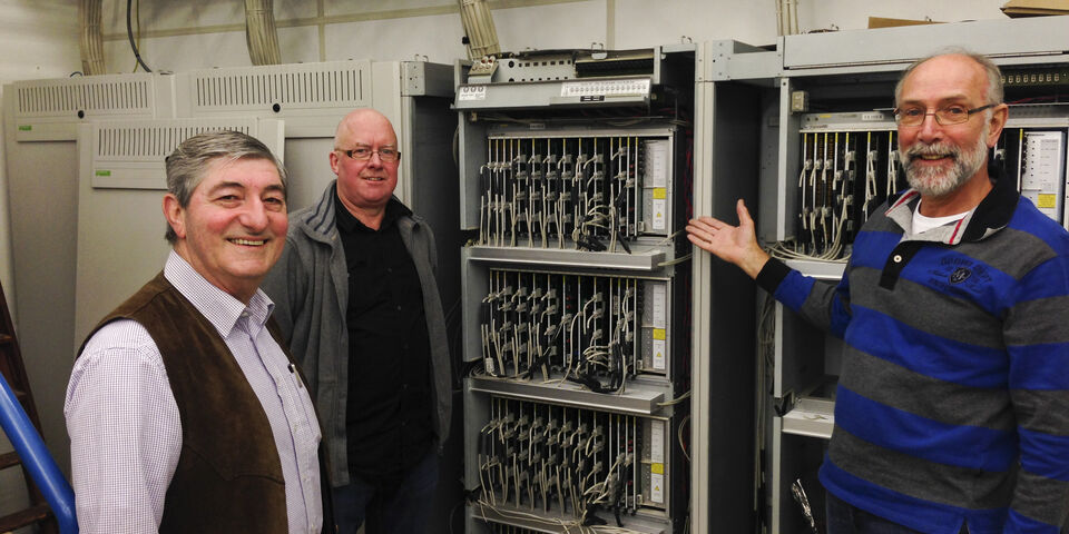 Noud Kandelaars (implementeerde centrale in 1997), Henri Timmers (nu verantwoordelijk voor de telefonie), André de Koning (beheer van de centrale tot en met november 2014)