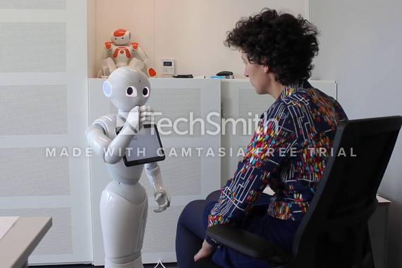 An actress in conversation with a Pepper robot. The answers are provided real-time via the internet by crowd workers. Video | Tahir Abbas
